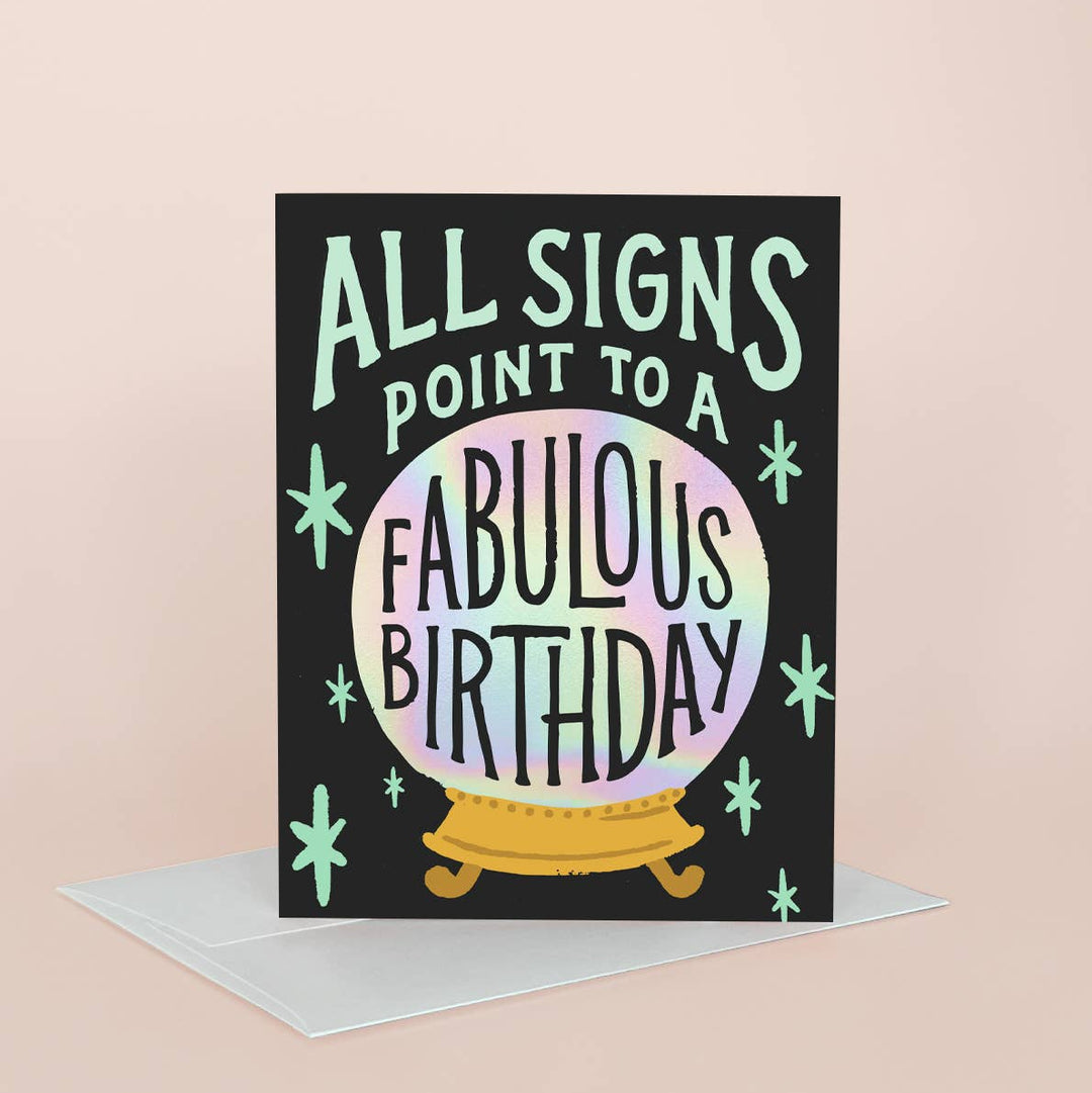 Greeting card with 'All signs point to a fabulous birthday' text on a black background