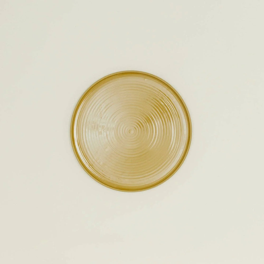 Amber glass plate with concentric circles, minimalist design