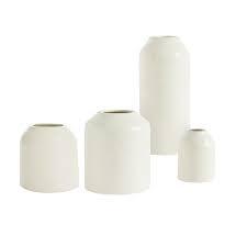 Set of white ceramic vases in varying heights for modern floral arrangements