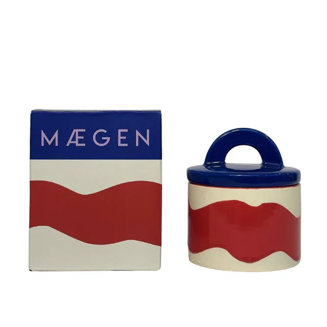 Red, white, and blue ceramic jar with wavy design and matching box