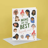 Greeting card with illustrations of diverse women's faces and text 'Moms are the Best, Especially mine' on a yellow background.