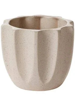 Beige textured ceramic planter with fluted design for indoor plants