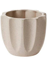 Beige textured ceramic planter with fluted design for indoor plants