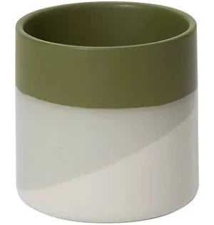 Two-toned green and white ceramic pot on a white background
