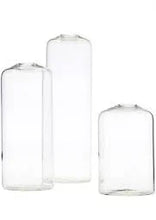 Clear glass vases for floral arrangements, perfect for fresh seasonal blooms and home decor